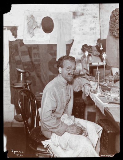 William Norris Applying Makeup for His Character of the King